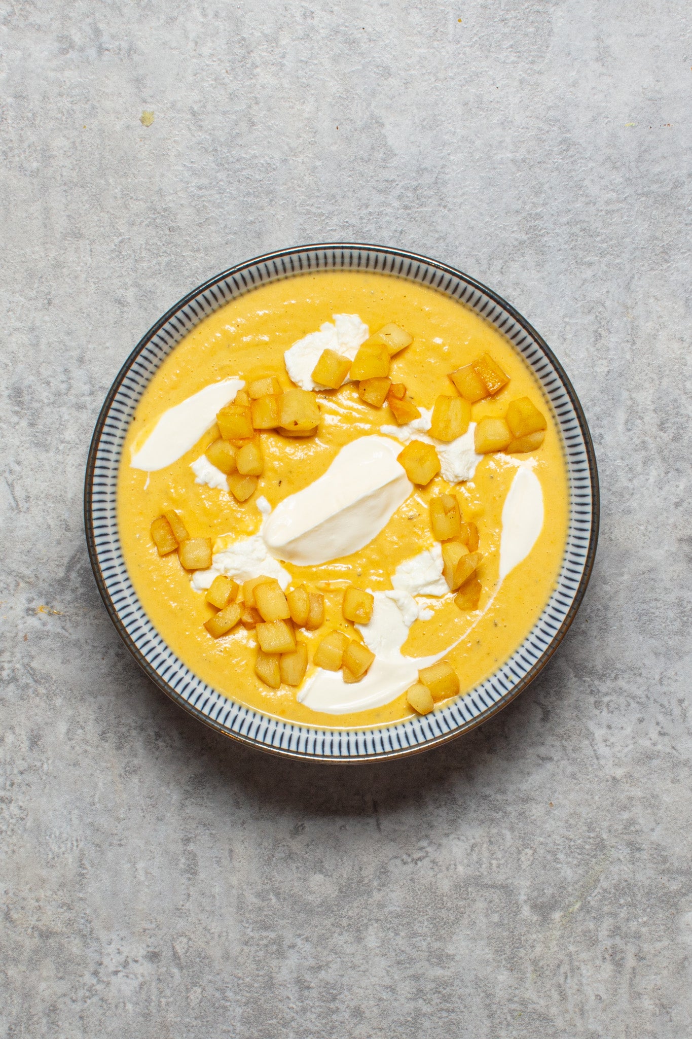 Creamy swede soup with a hit of tangy goat’s cheese and fried apple sweetness for balance