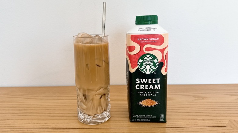 Starbucks Brown Sugar Inspired Sweet Cream Enhancer bottle and glass of iced coffee