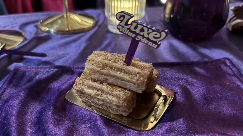 Salted Caramel Churros on a tiny gold tray