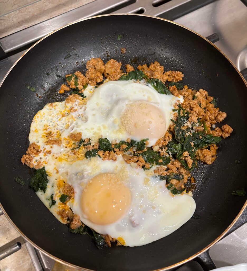 Bolognese leftover minced pork with fried egg and spinach