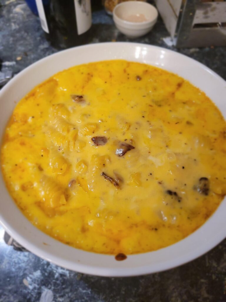 Sharp cheddar and smoked gouda mac with peppered bacon