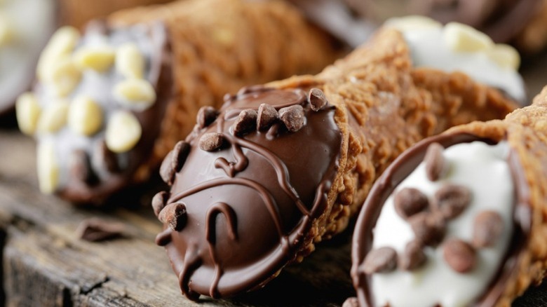 Close-ups of chocolate cannoli.