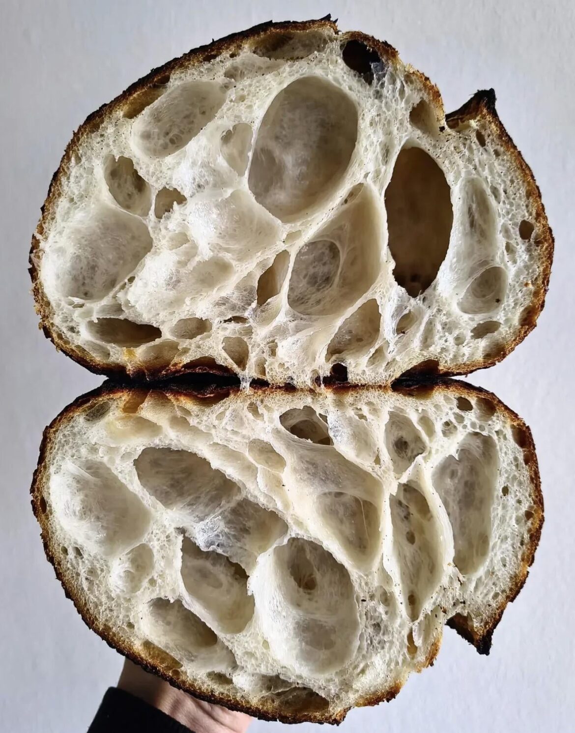 HOW do you achieve a crumb like this? High heat? Small loaves? Black magic? It’s more air than bread!