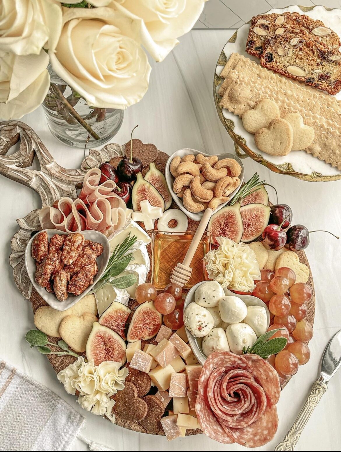 Still one of my most favorite boards I have ever made. The cheese that looks like ruffles is called Tête de Moine - Trader Joe’s sells it sometimes already sliced like that, otherwise you can do it yourself using a girolle. 🤍Love, your cheese pal Kelsey over at The Board Loon