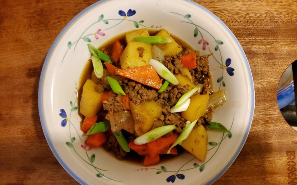 Took 2 frozen beef patties, one Idaho potato, 2 carrots, ginger, and half onion to make this soy sauce based beef stew.