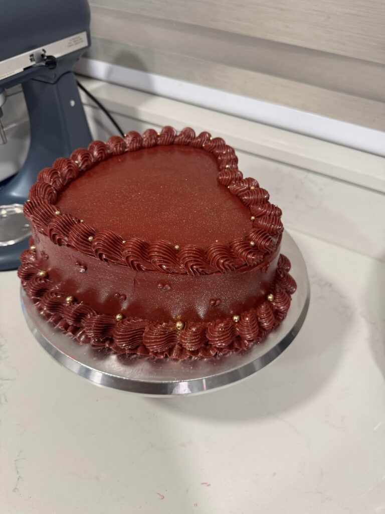 My first heart cake in a deep burgundy red with gold pearl sprinkles and glitter.