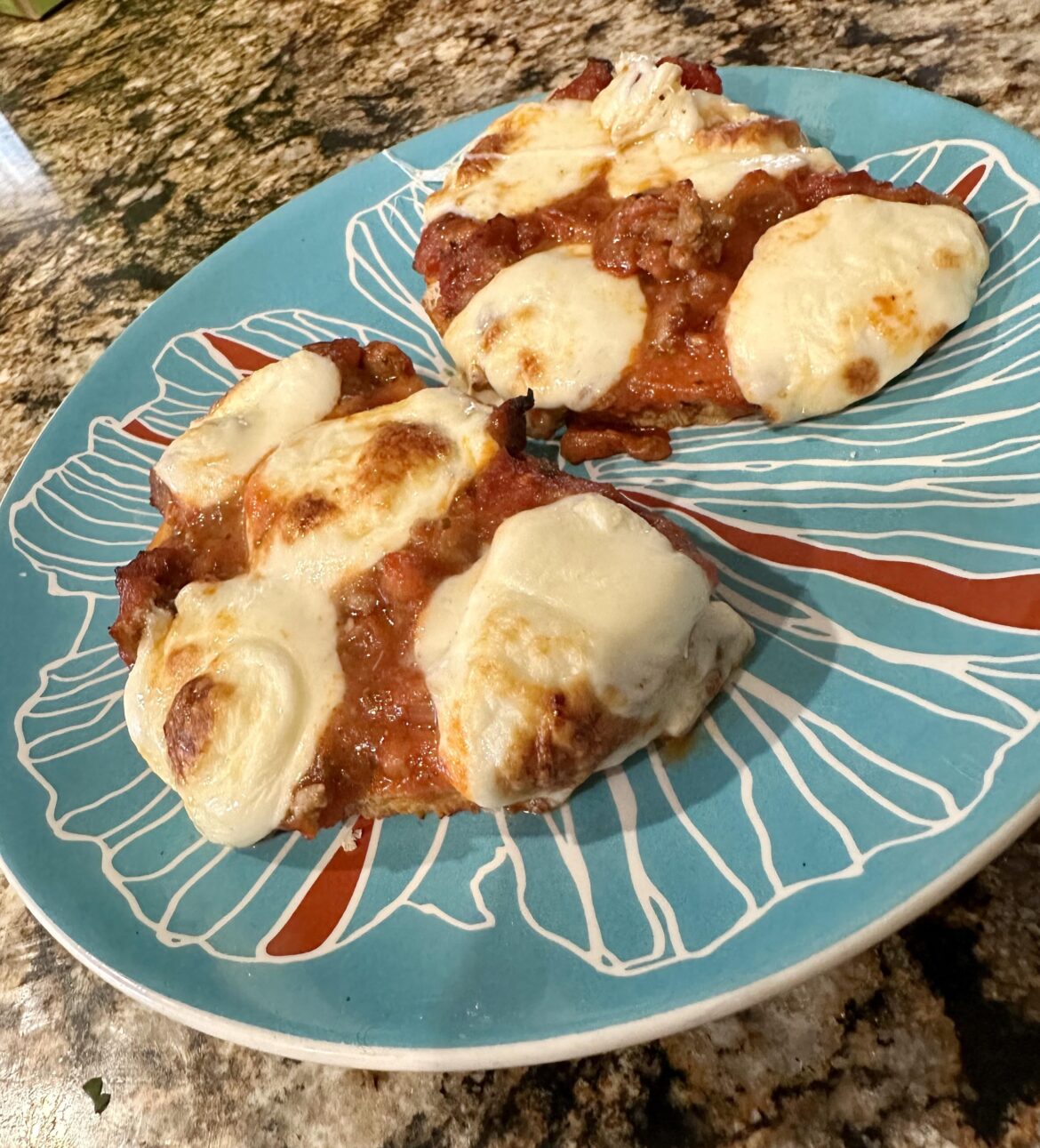 Open Faced, Oven Baked Crisp Bread with Meat Sauce and Fresh Mozzarella Balls