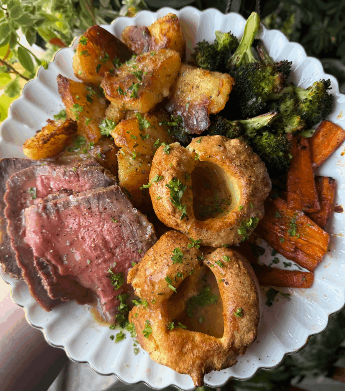 Roast beef, roasties, yorkshire puddings, broccoli, and carrots for dinner tonight