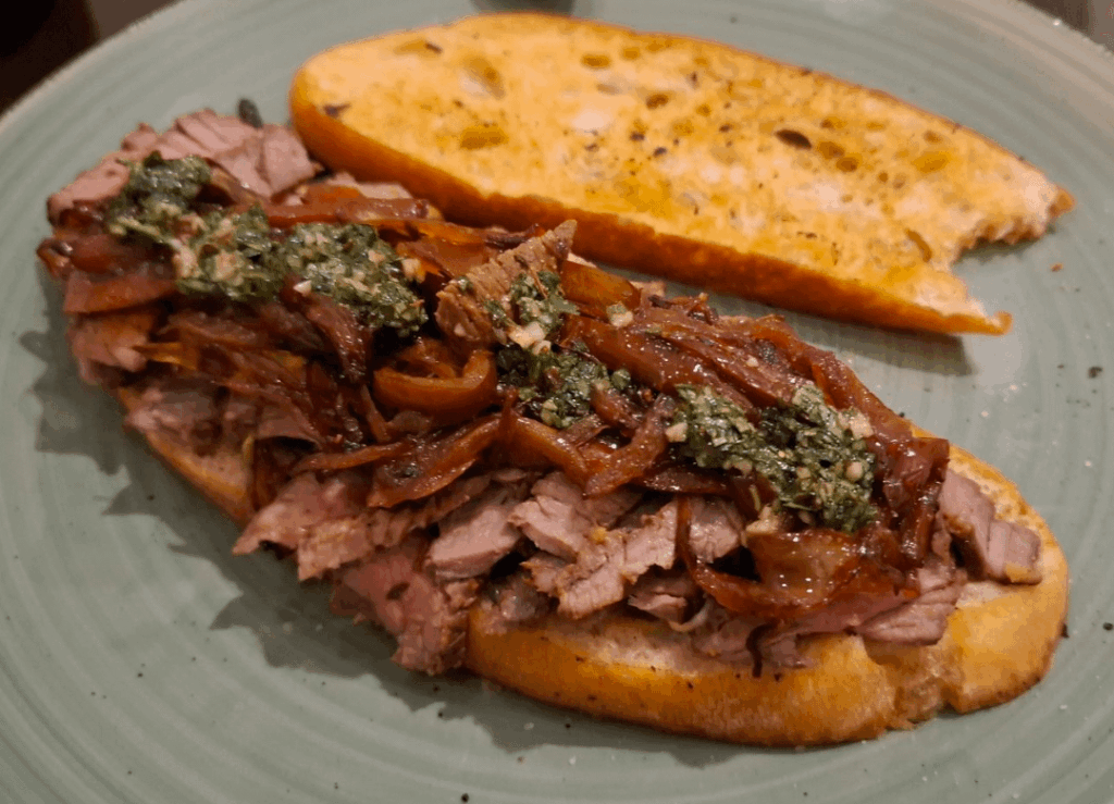 [Homemade] Marinated steak sandwich with pepper, onions and chimichurri