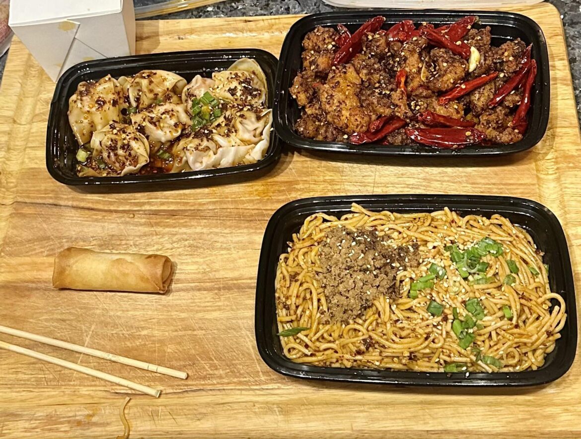 Chengdu Impression delivery night: Yinbin flaming noodles, Szechuan wontons, dry chili chicken, and the one of the two complimentary spring rolls that wasn’t housed immediately before the bag was unpacked.