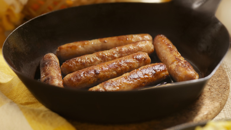 Breakfast sausages in a cast iron skillet