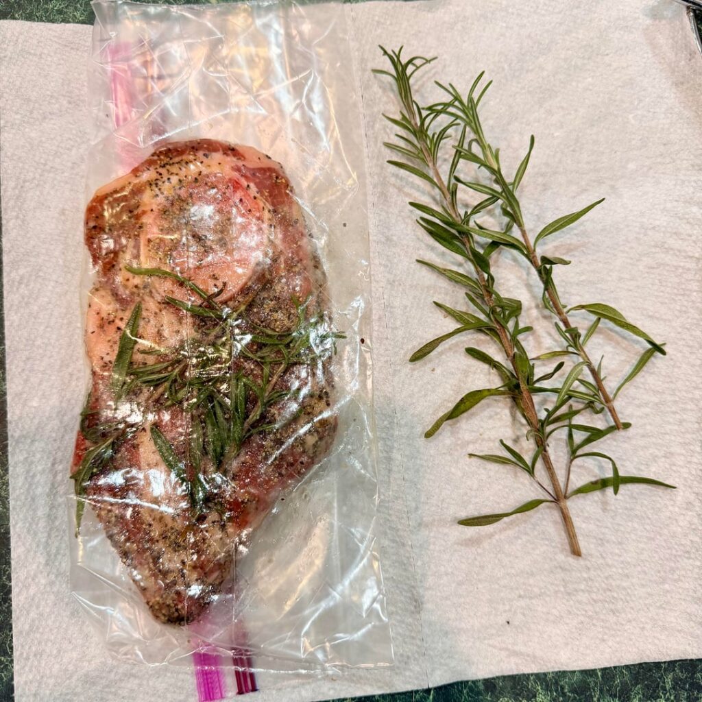 Lamb shoulder marinated for 24 hrs. Rosemary from out of my Graden