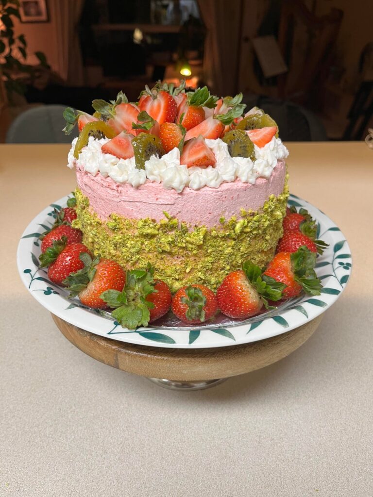 Vegan gluten free vanilla cake with strawberry filling and frosting