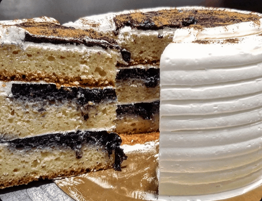 Vanilla cake with blueberry filling and marshmallow cream.