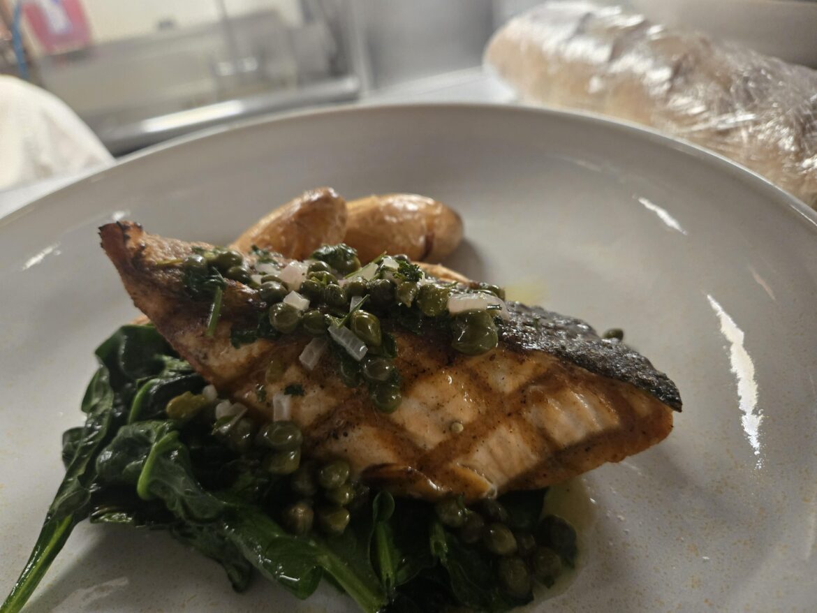 Grilled salmon, fingerling, spinach, capers and preserved lemon.