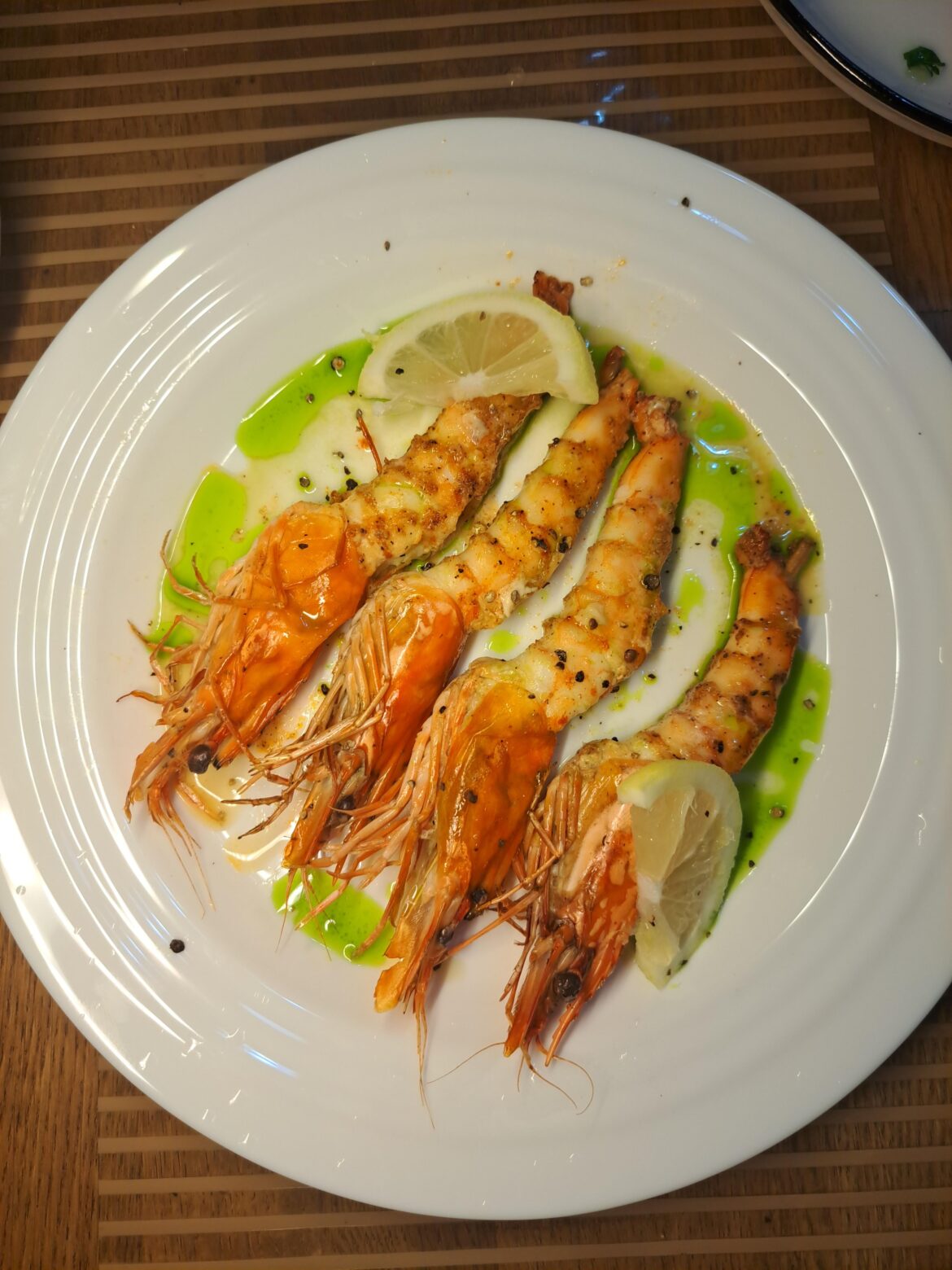 Grilled Tiger prawn with parsley infused oil & coarse black pepper