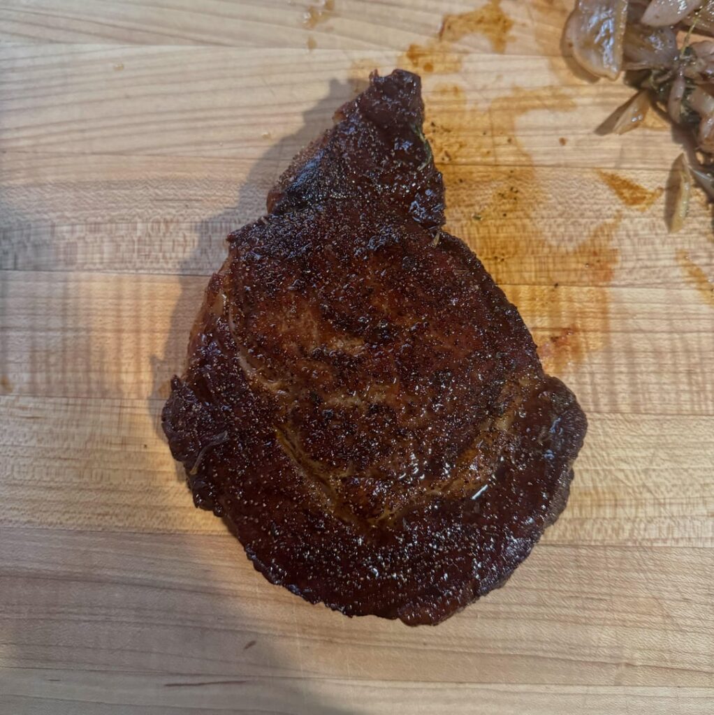 first time with a ribeye this thick and no thermometer. tried for medium-rare and it came out better than i expected. still working on the crust.