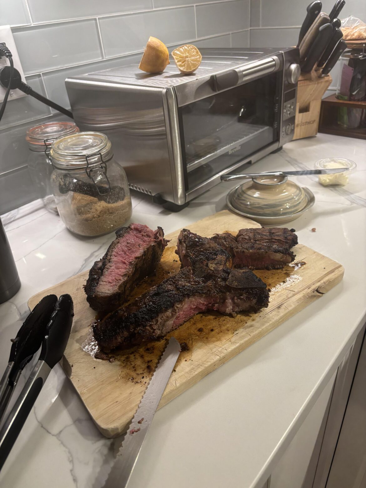 How did I do? 2 1/2 inch thick porterhouse. The wife likes her filets, I enjoy a med rare sirloin.