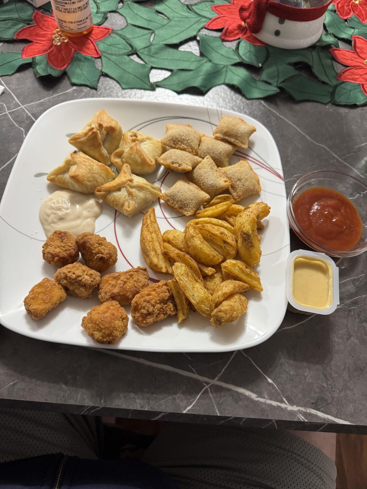 Trashy snack food night for dinner. Pizza rolls, potato wedges, chicken bites, some sort of mini “beef Wellingtons”