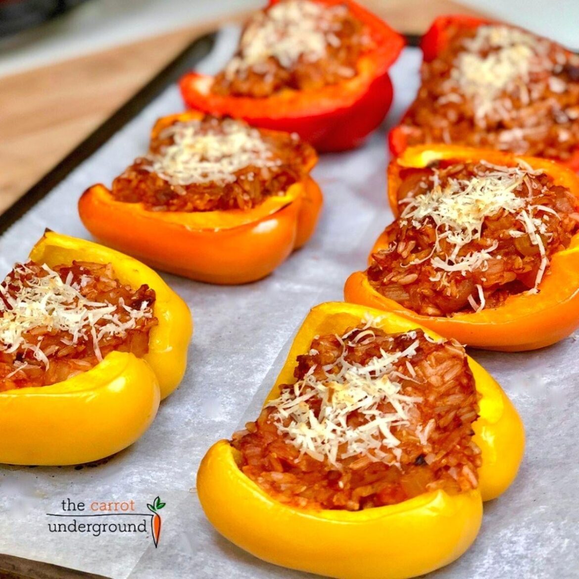 Vegan Stuffed Bell Peppers 🌱 oven roasted peppers filled with rice, veggies, and plant-based protein in a rich & savory tomato-based sauce.