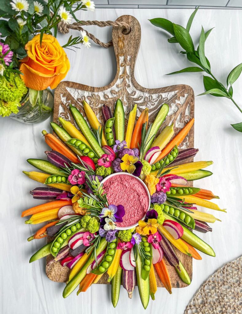 Not charcuterie, but another board nonetheless. 💚Crudité board I made in 2022 - no, this is NOT AI. I work hard on all my boards and it’s sad that I even have to say that. The dip is lemon beet hummus from the brand Ithaca.