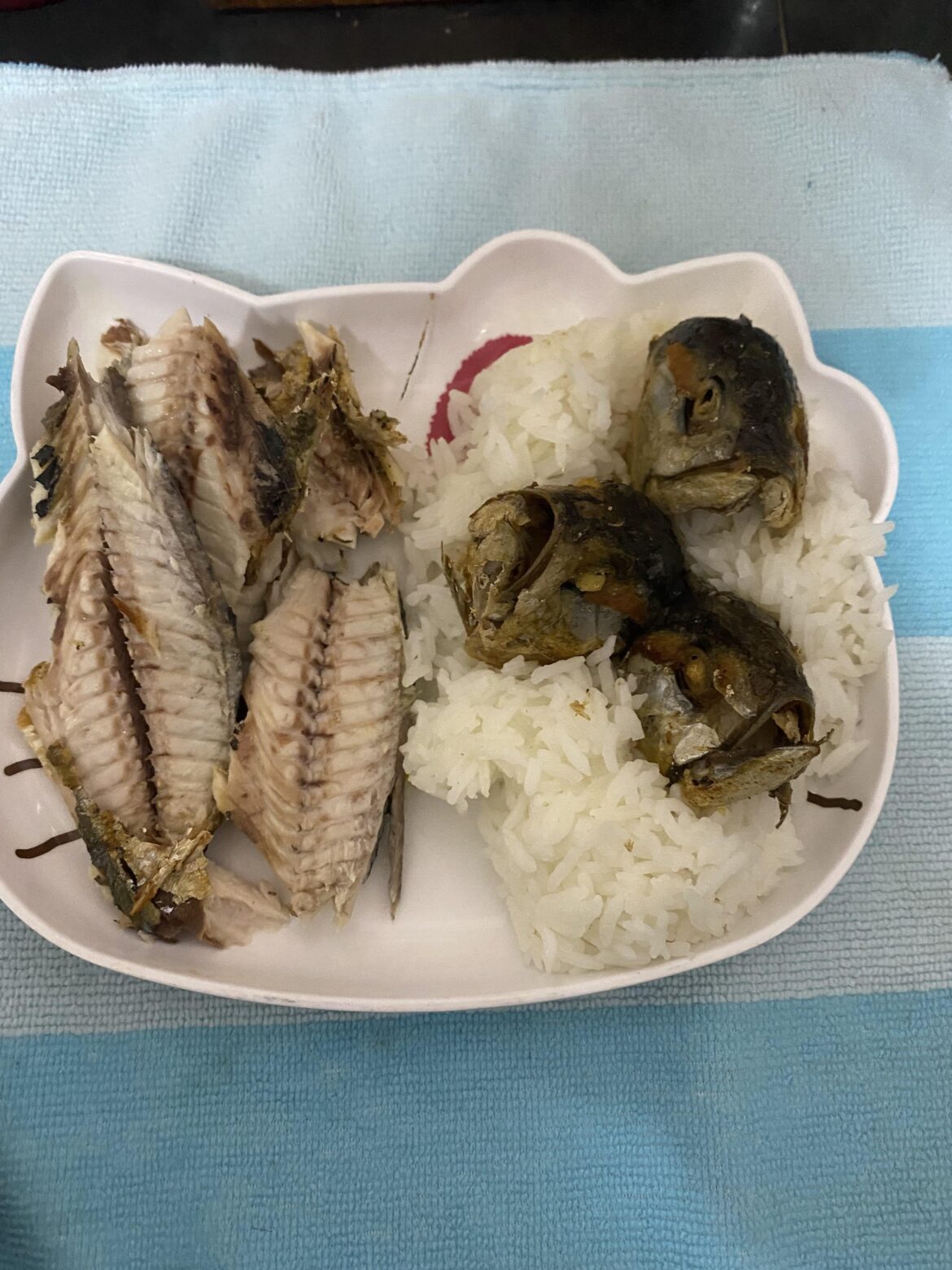 Tonight dinner, Fried fish with rice. Yes i also eat the heads