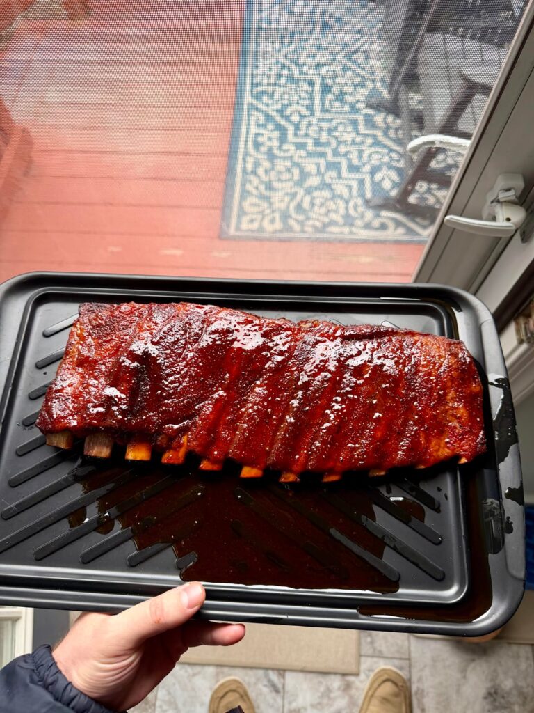 Ribs on my Traeger 34 before the snow storm. 2-2-1 method. 1st pic before saucing and 2nd pic after resting. Tad bit dry but damn good still