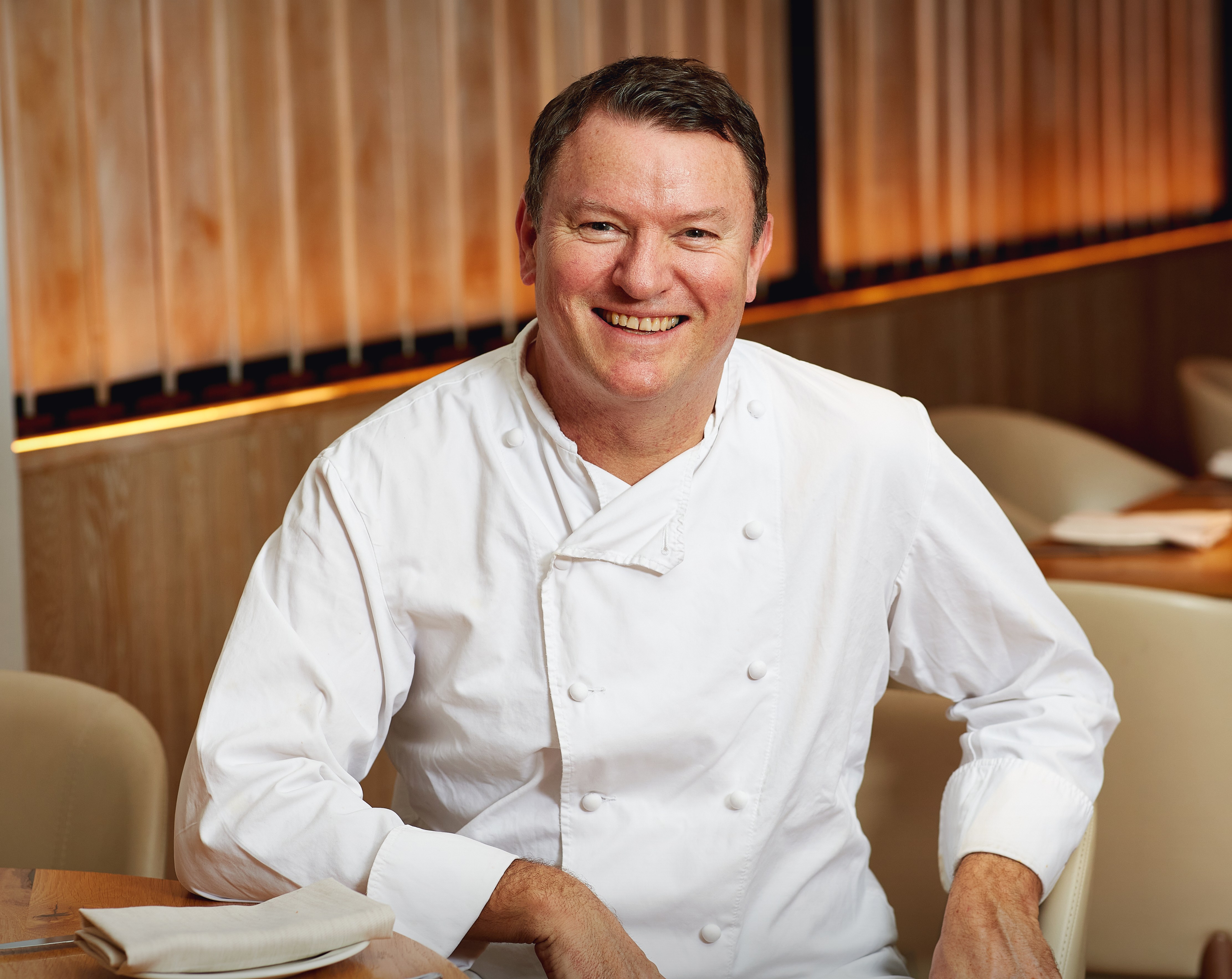 Portrait of Theo Randall in a chef's jacket.