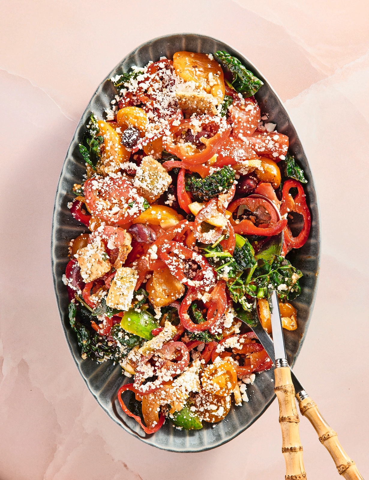 Tomato Panzanella salad topped with feta cheese.