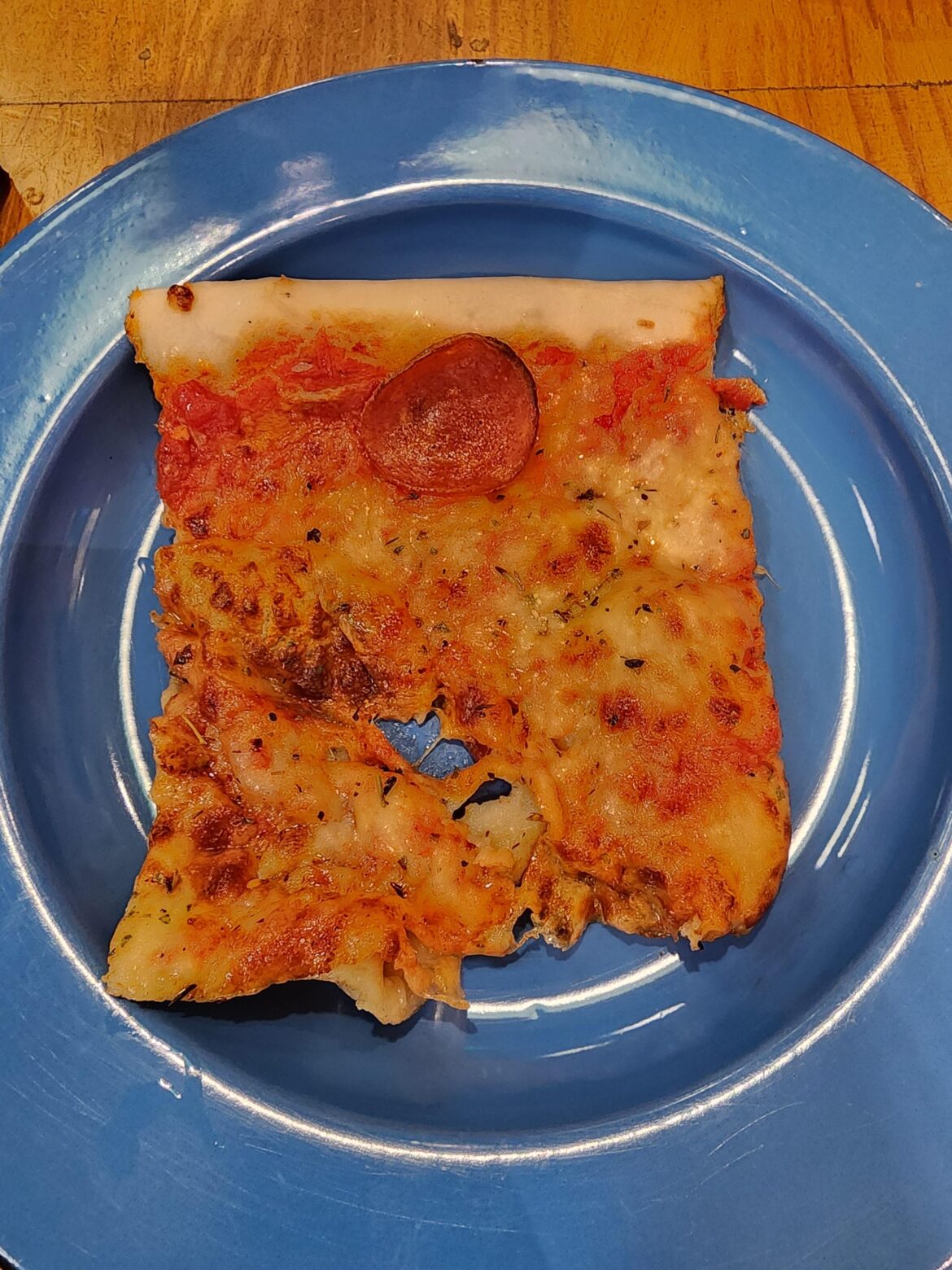 A pizza slice that cost 38 real (about 9$ CAD) that I bought from a Jamie Oliver.