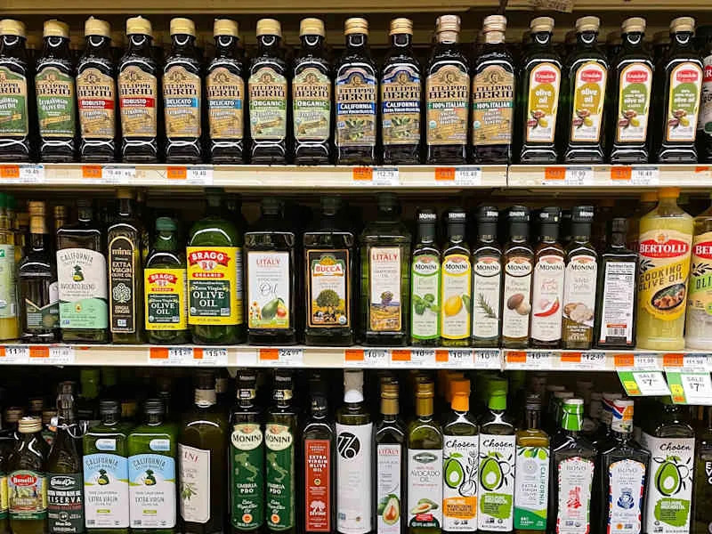 Olive oils on shelf at grocery store