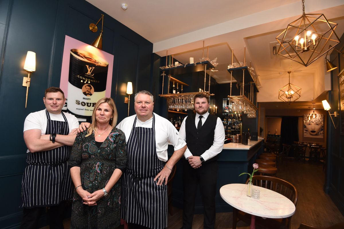 Marc and Michaela Verite( centre) with sons Jacques (left) and Charlie (right)