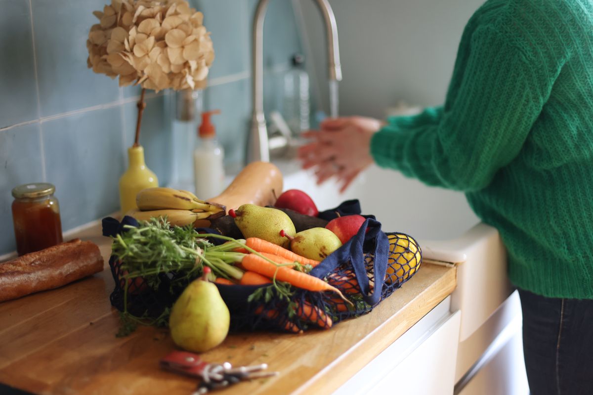 woman washing vegetables