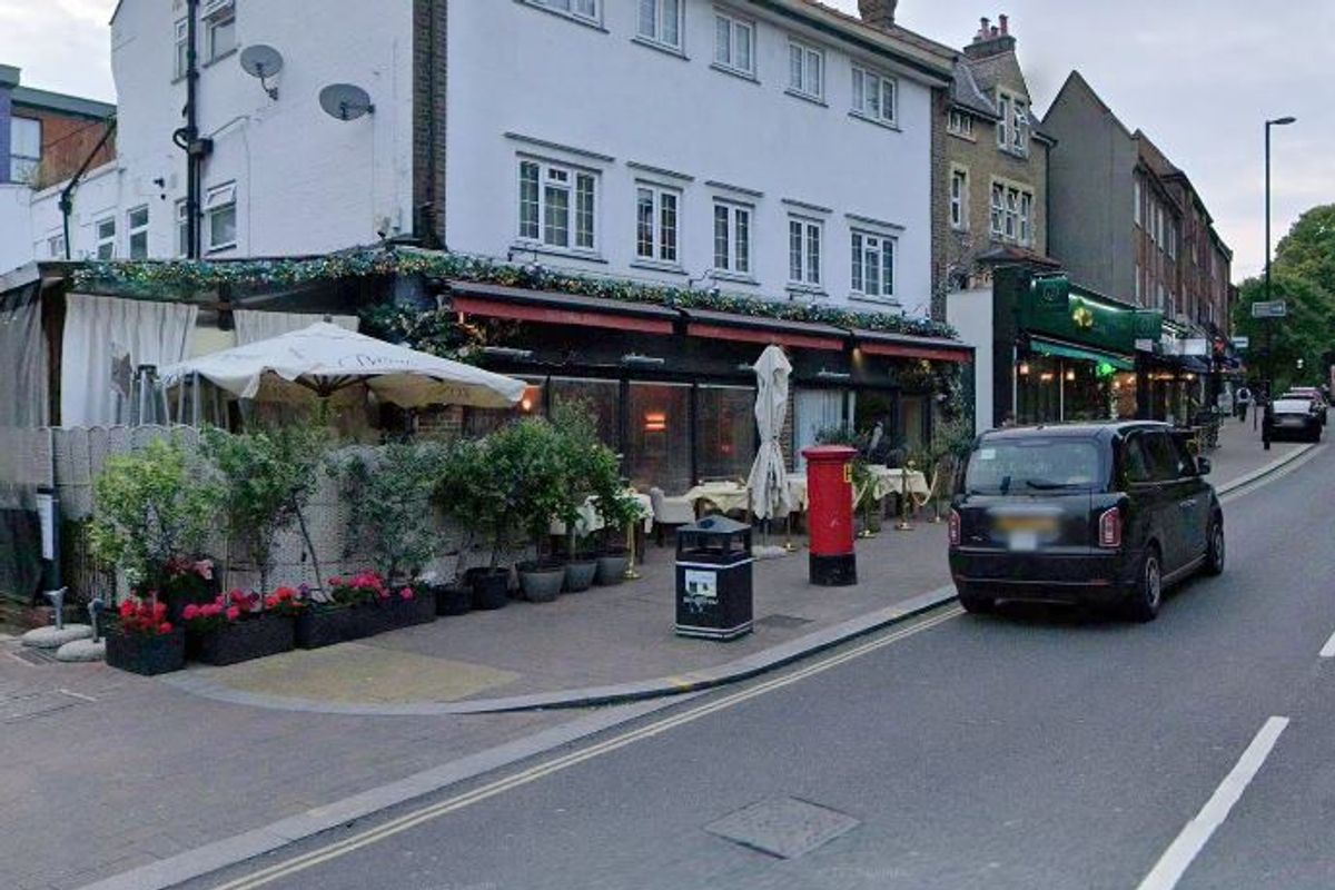 A taxi parked outside Pierluigi's in Beckenham High Street