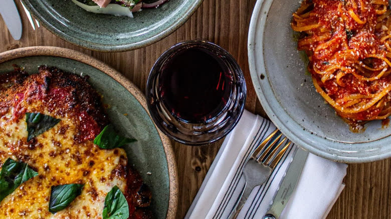 A bowl of salad and pasta on a table at Cane Pazzo in Hanahan
