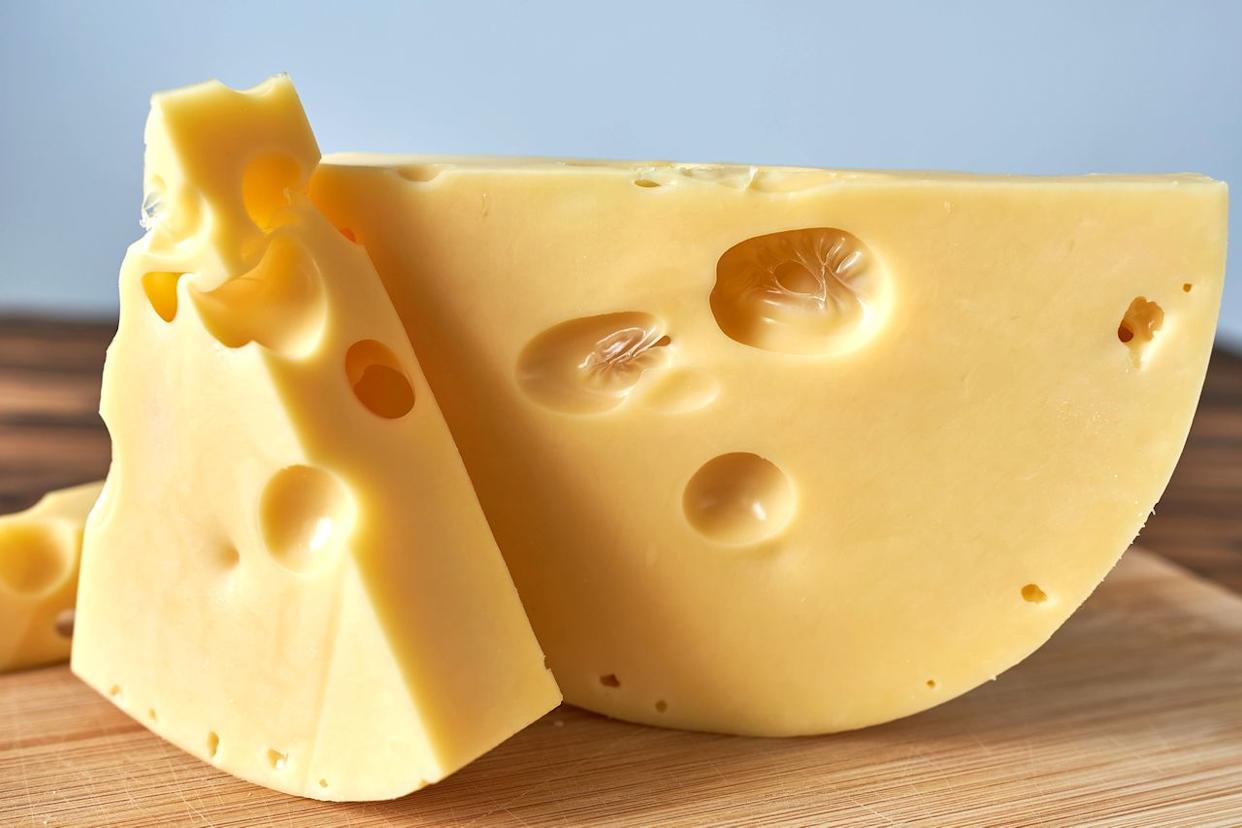 Grate Emmentaler (pictured) and other cheeses on a box grater so they melt smoothly and evenly. Natalia Rusanova / Getty Images