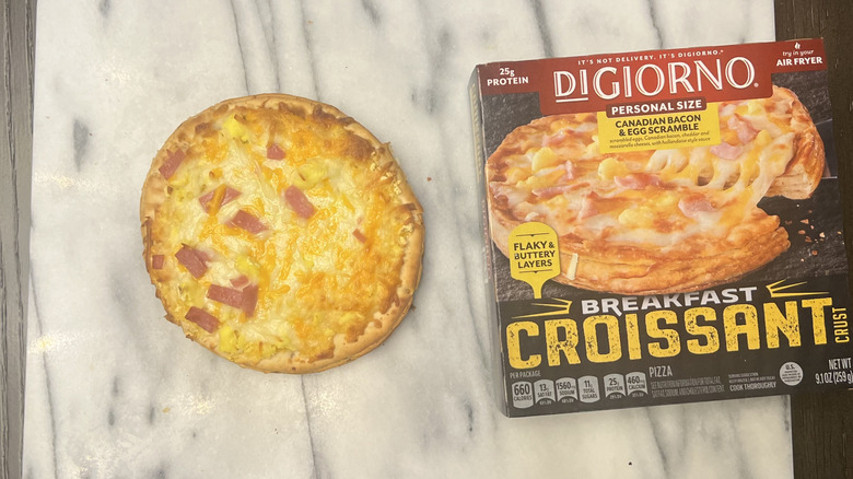 DiGiorno Breakfast Croissant Crust Ham and Egg Pizza on serving tray.