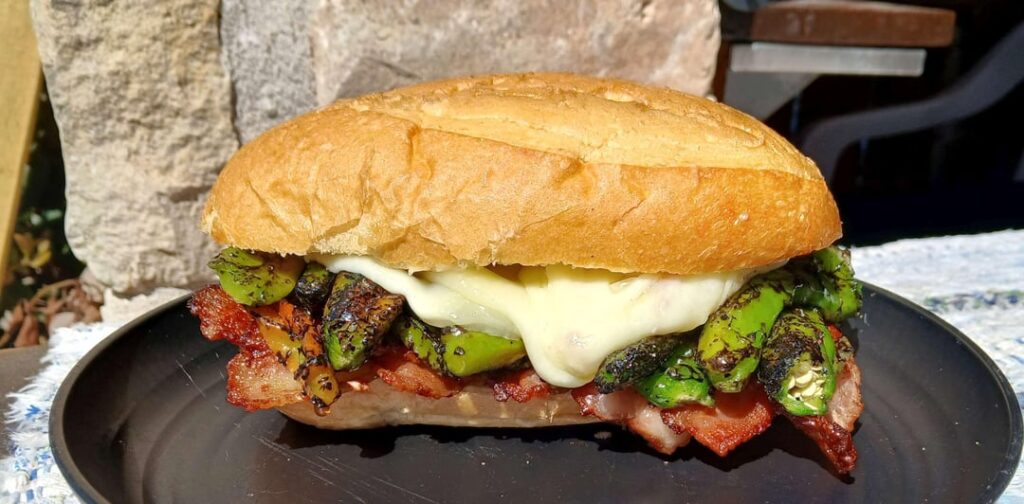 Roasted Shashito peppers, bacon, Oaxaca cheese and lime mayo on a crispy toasted bolilo roll.