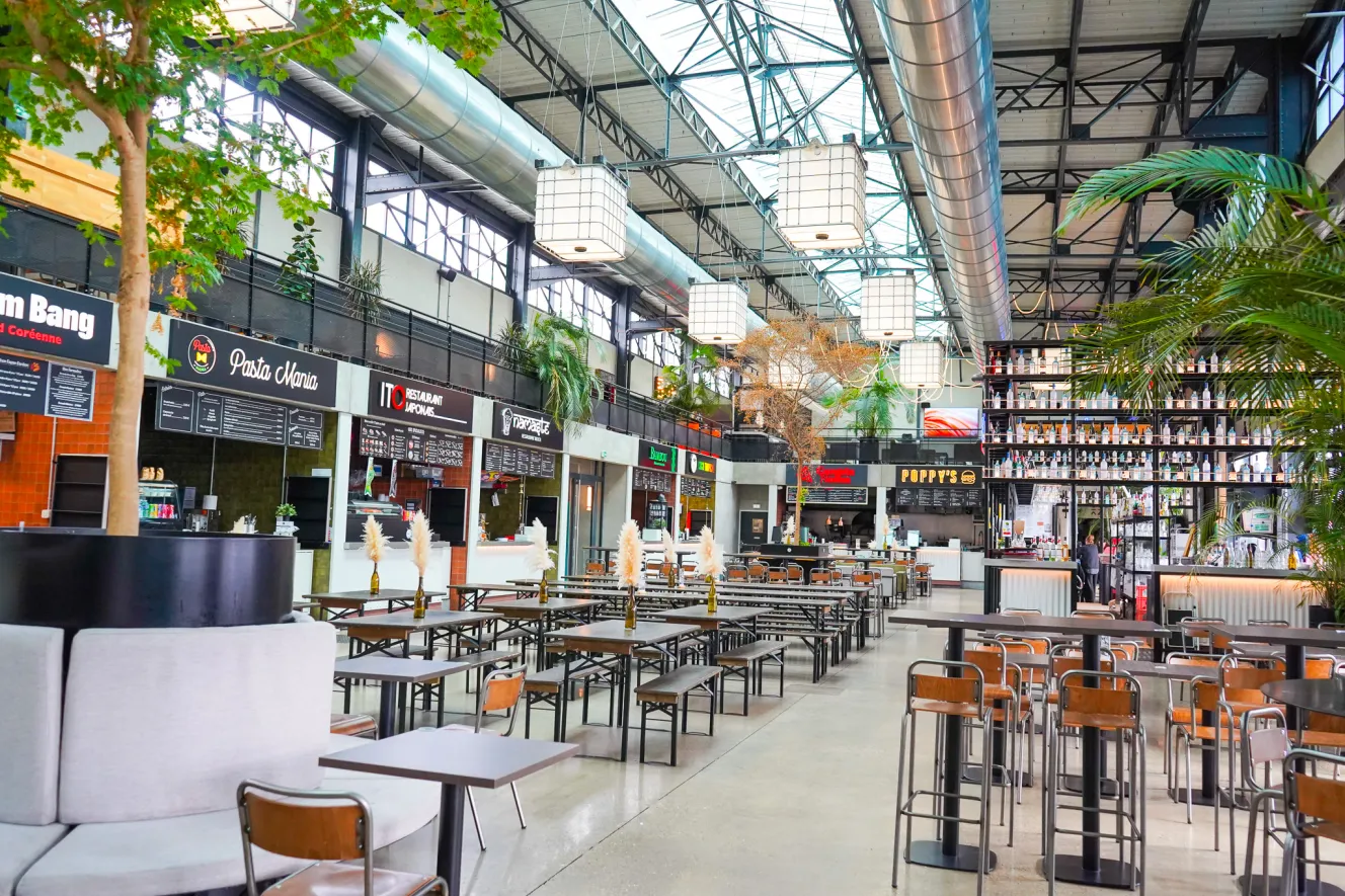 Interior view of Entrepot Food Hall with multiple restaurant stalls and dining areas.