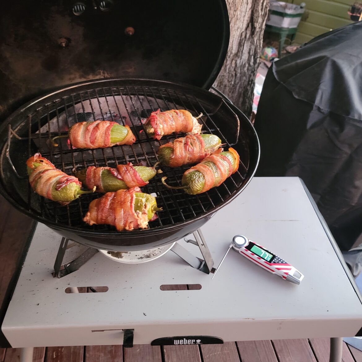 Some back wrapped stuffed jalapeños with cream cheese and pulled pork