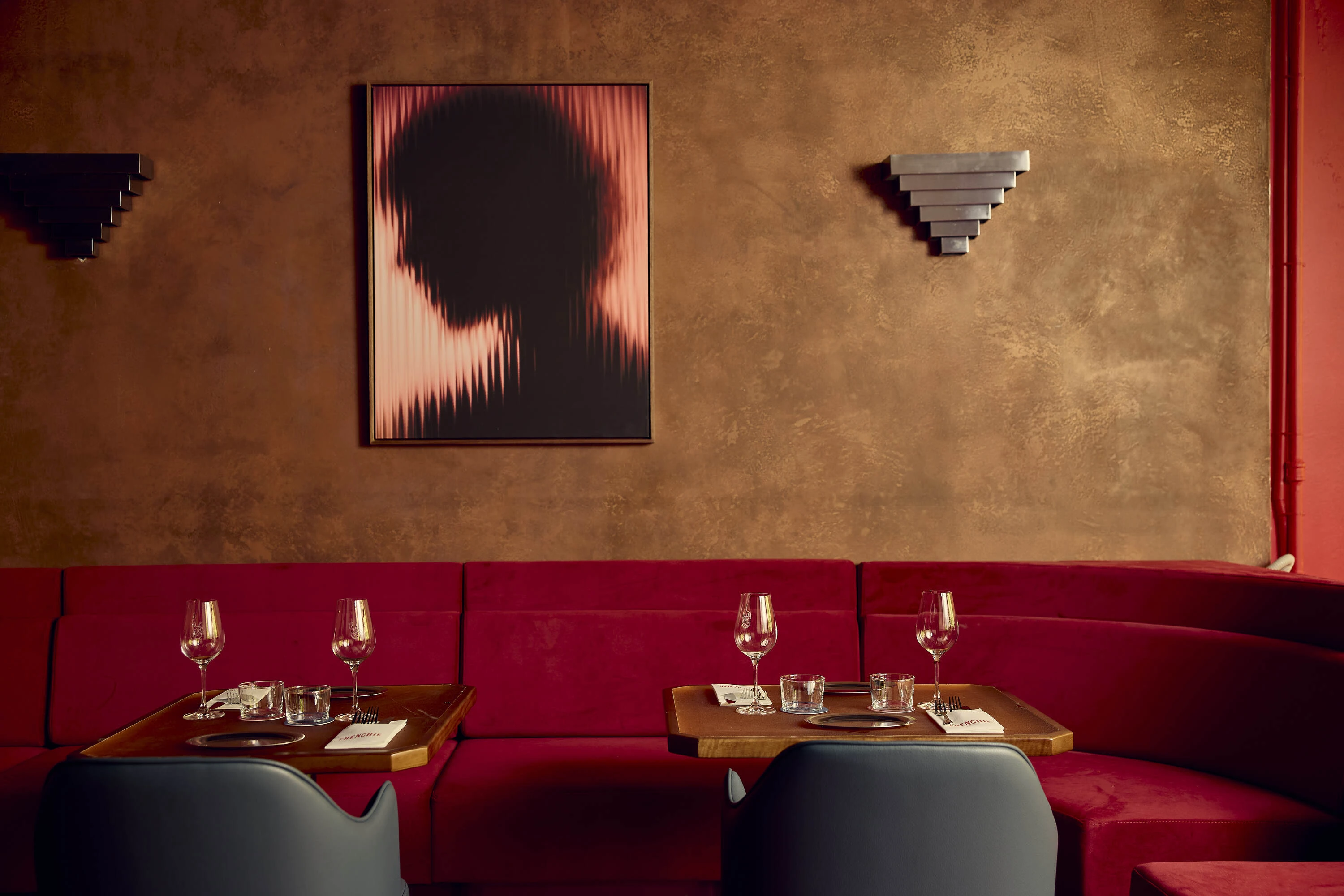Artwork and dining tables at Frenchie. 