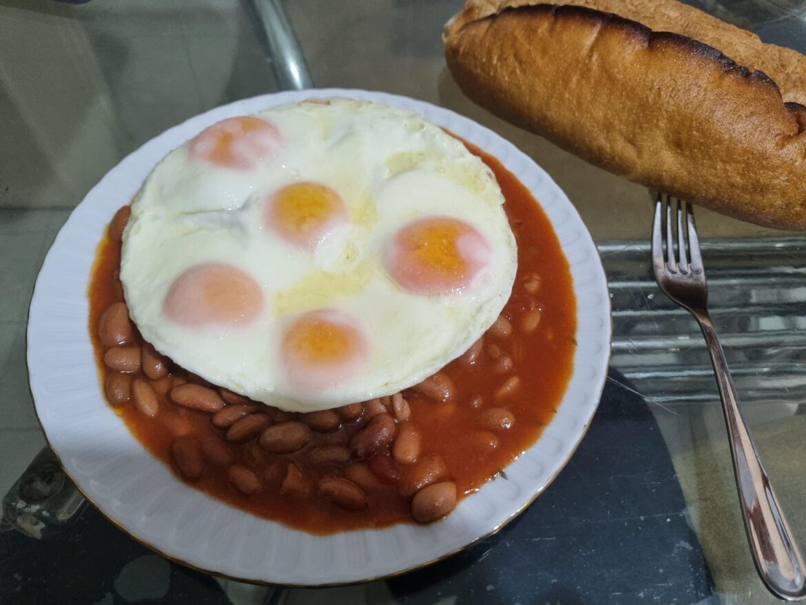 I have allowed my intrusive thoughts to win, and I don't regret it. Canned beans, sunny side up eggs and an entire loaf of bread.