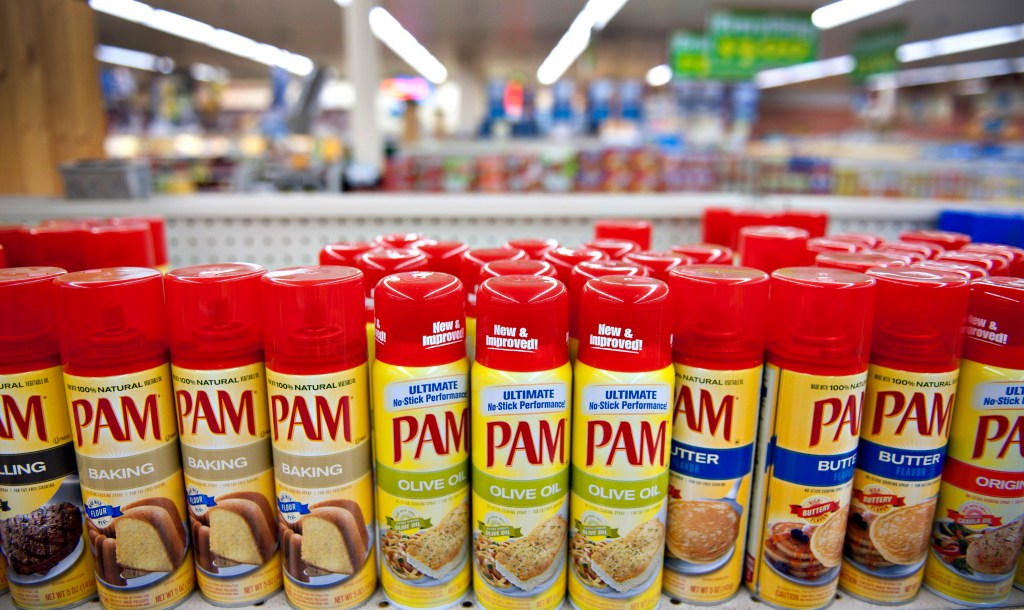 Pam brand cooking sprays on display in a supermarket.