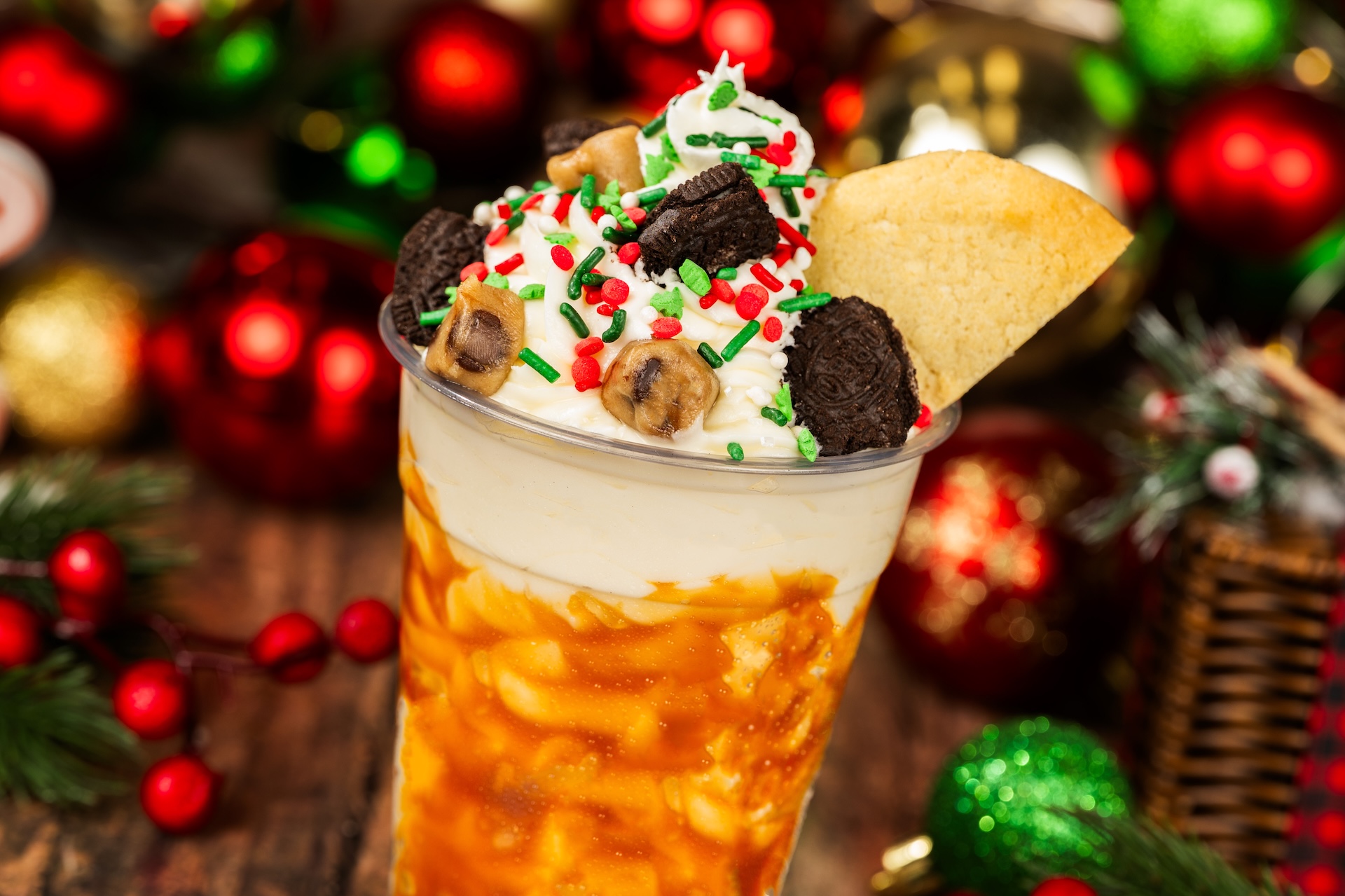 Milk and Cookies Shake: Vanilla shake with caramel, holiday cookies, and chocolate chip cookie dough topped with whipped cream and festive sprinkles