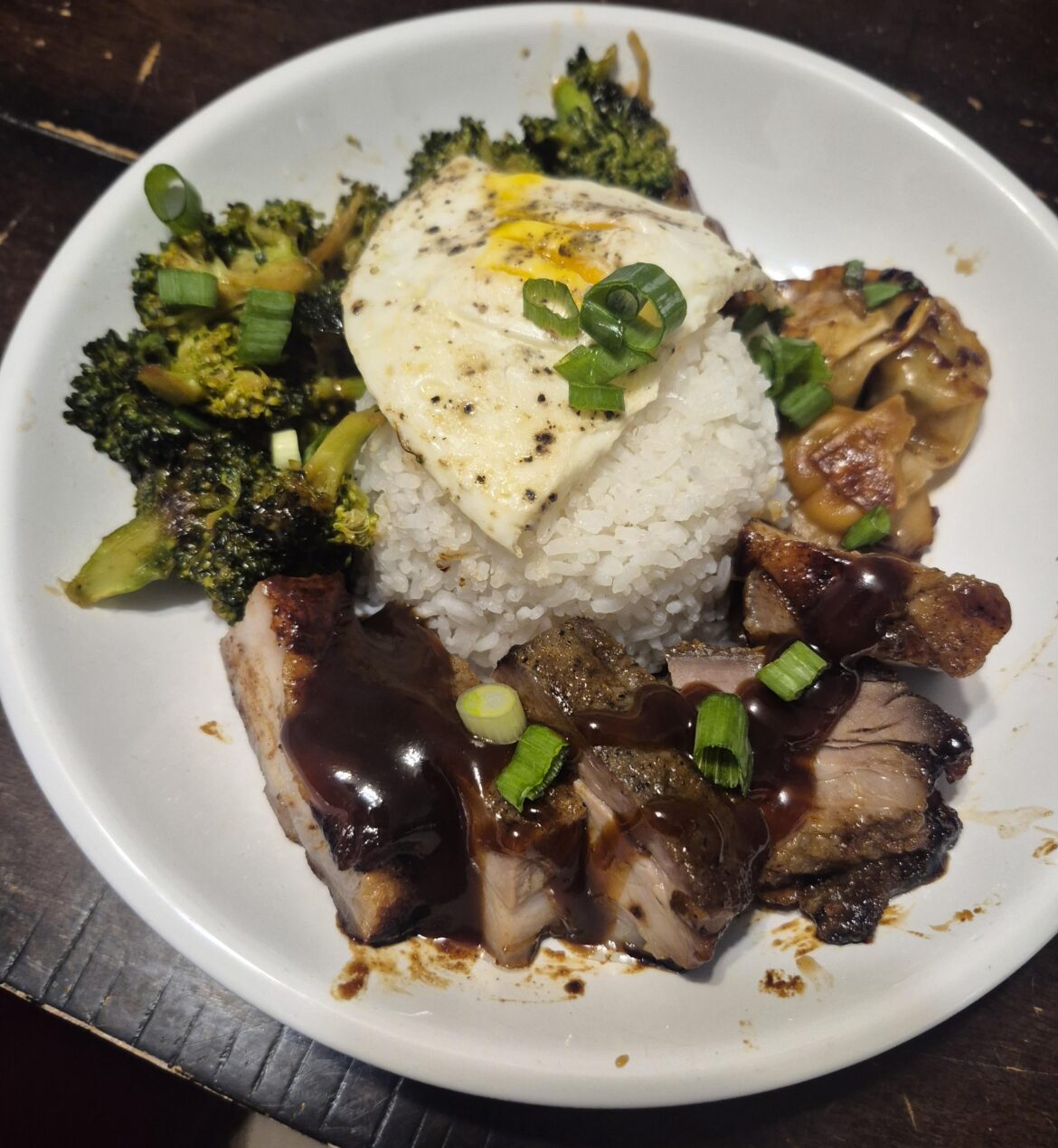 Hoisin-glazed pork belly, broccoli & garlic, rice, dumplings, and, runny egg