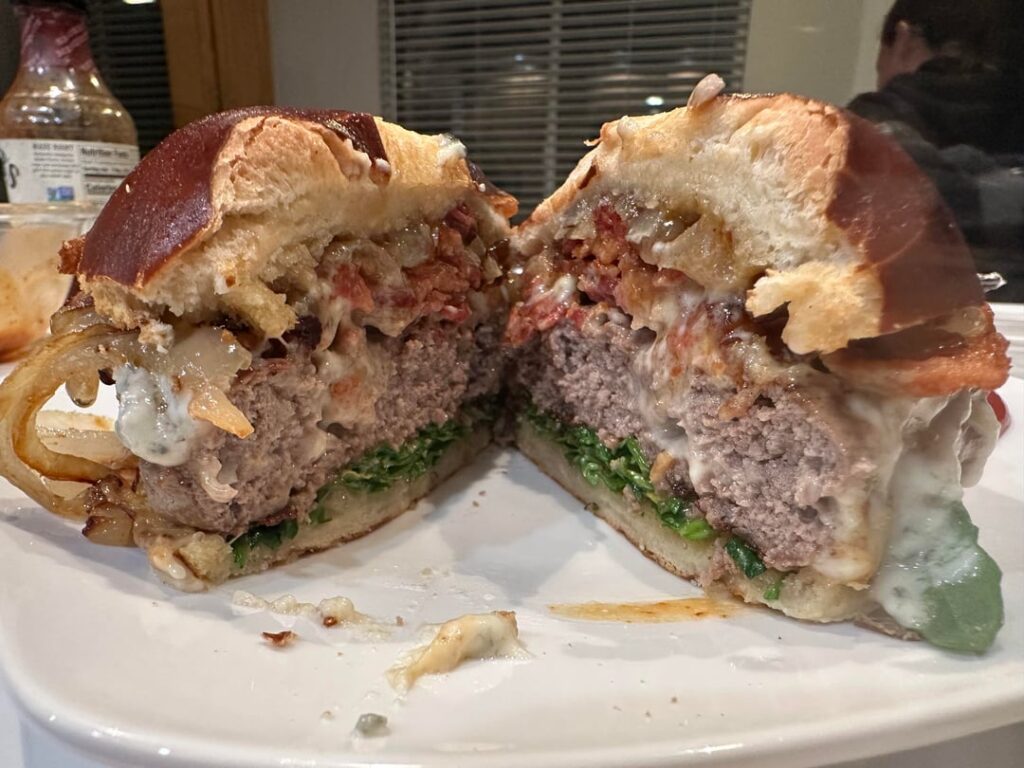 Blue cheese bacon burger with grilled onions and fig spread