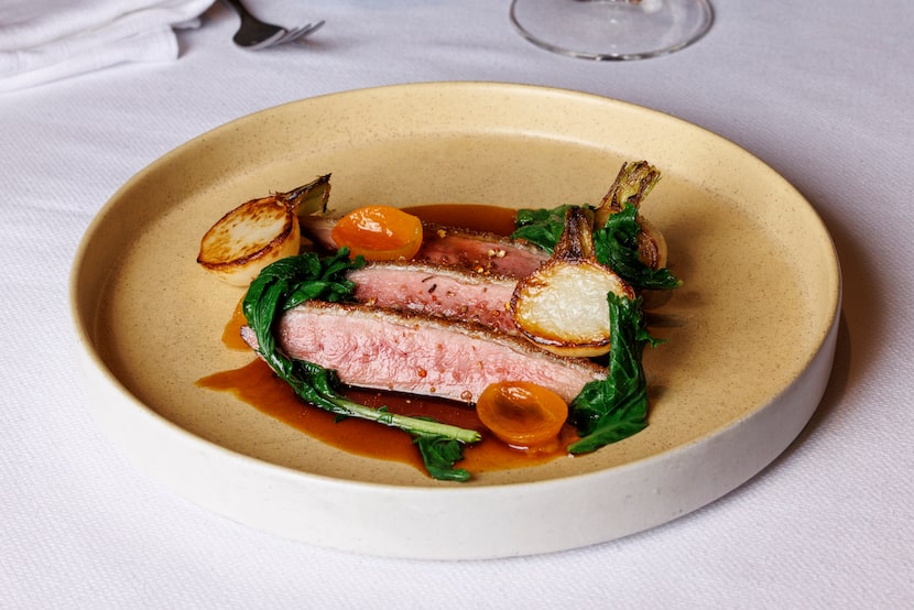 The hot honey crispy duck breast is served with Hakurei turnips and confit kumquats. 