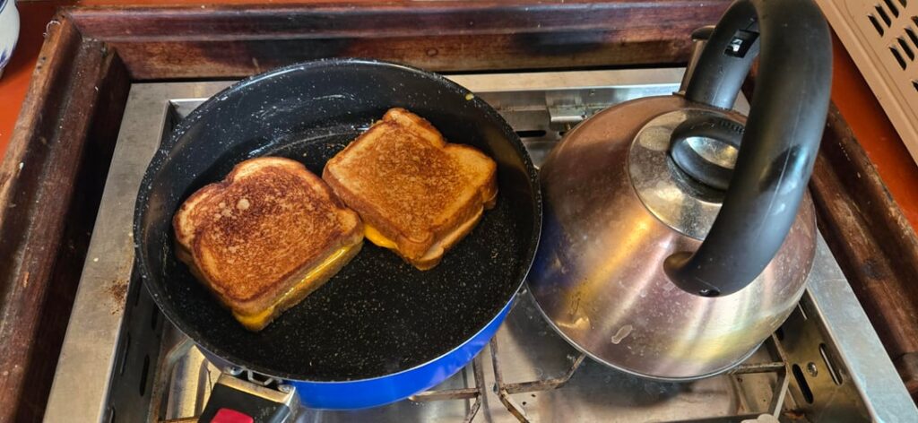 Nothing better than grilled cheese cooked on a gas stove in a sailboat galley