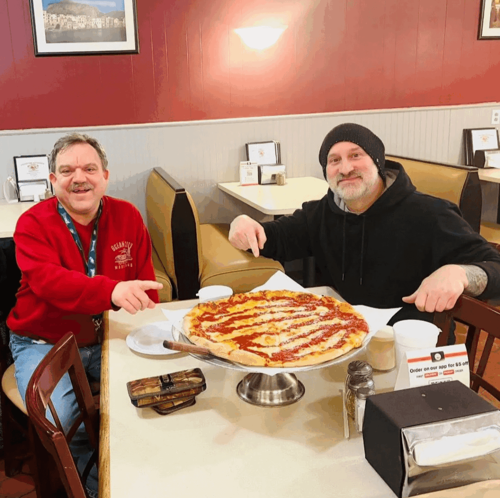 My husband and I enjoying a pizza for our 12th anniversary ❤️ 🍕😁