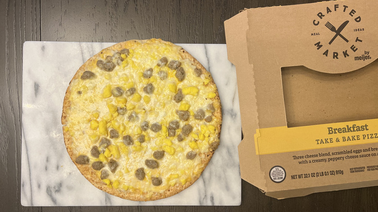 Crafted Market by Meijer Breakfast Pizza on serving tray.